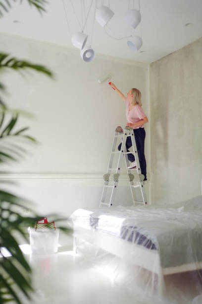 istock DIY: A woman's painting her own apartment 2161507209