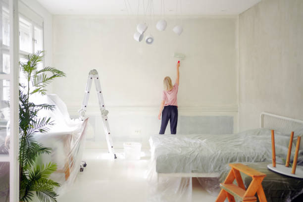 istock DIY: A woman's painting her own apartment 2161507211