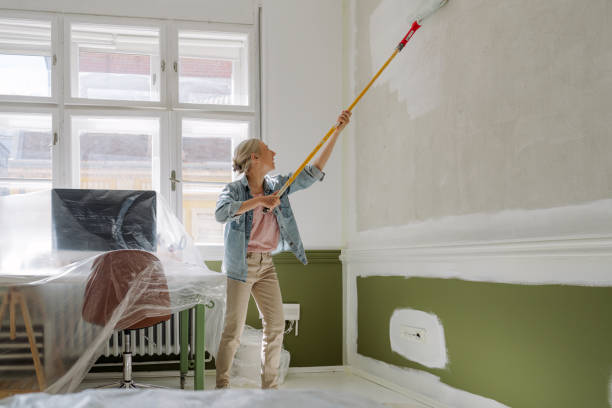 istock DIY: A woman's painting her own apartment 2161507218