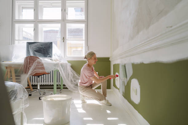 istock DIY: A woman's painting her own apartment 2161507236