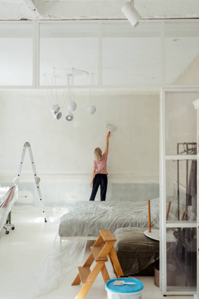 istock DIY: A woman's painting her own apartment 2161507237