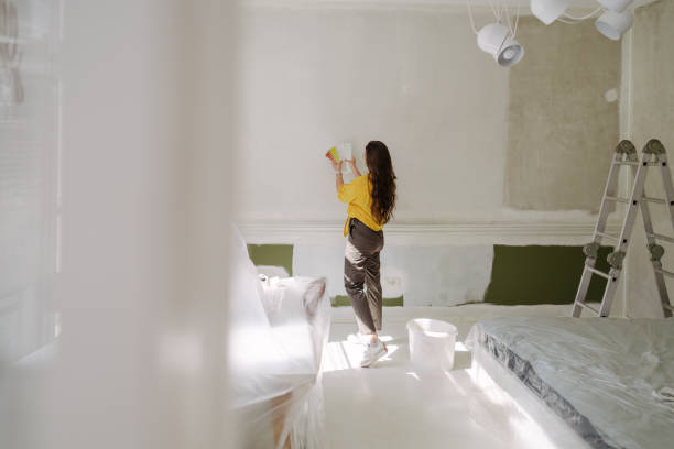 istock Choosing a wall paint shade from a colour swatch 2161507238