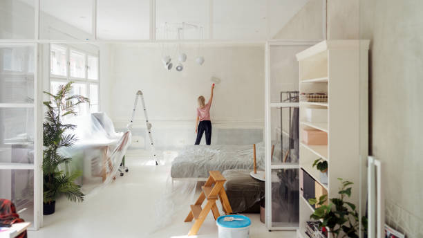 istock DIY: A woman's painting her own apartment 2161507239