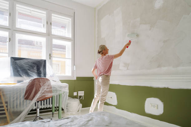 istock DIY: A woman's painting her own apartment 2161507244