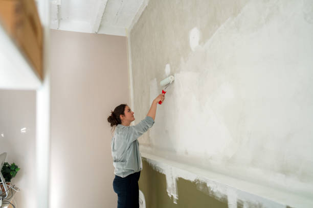 istock DIY: A woman's painting her own apartment 2161507265