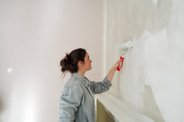 istock DIY: A woman's painting her own apartment 2161507271