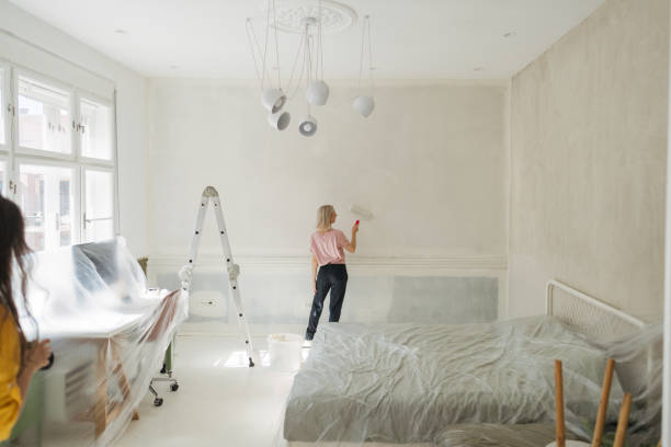 istock DIY: A woman's painting her own apartment 2161507275