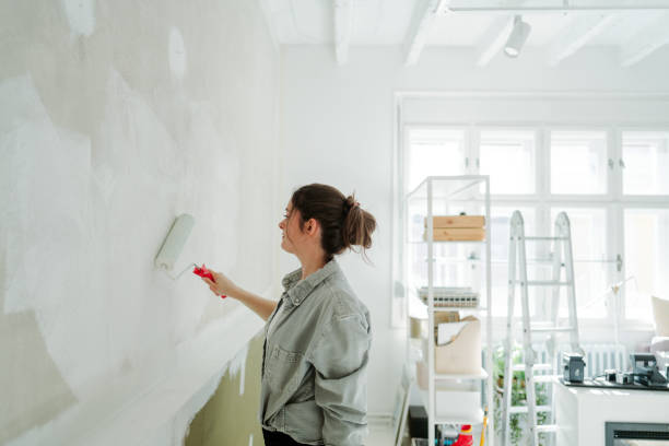 istock DIY: A woman's painting her own apartment 2161507276