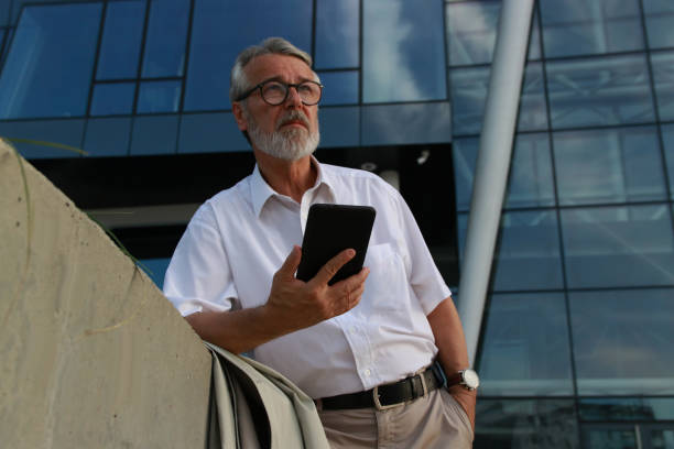 istock Senior modern businessman with digital tablet 2161509265