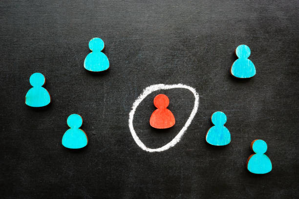 istock Figures and one special one circled as a problem employee for dismissal. 2161509445