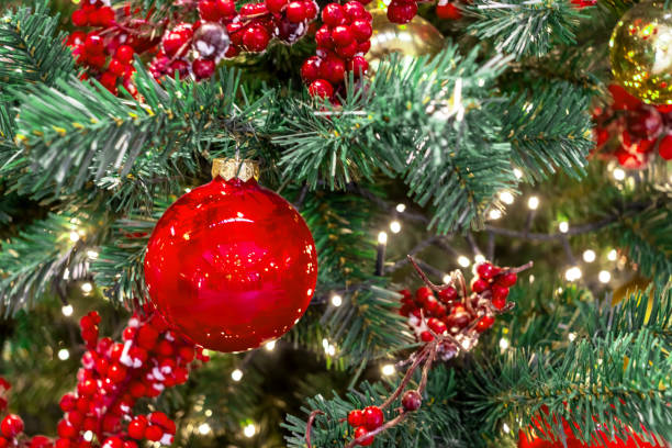 istock Bright red ornaments on Christmas tree are balls and berries 2161510468