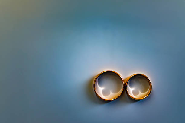 Gold wedding rings for newlyweds on wedding day