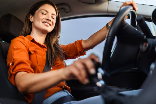 istock Young Businesswoman Holding Gear Shift 2161510816