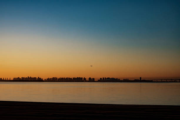 Seaside city with rosy sky