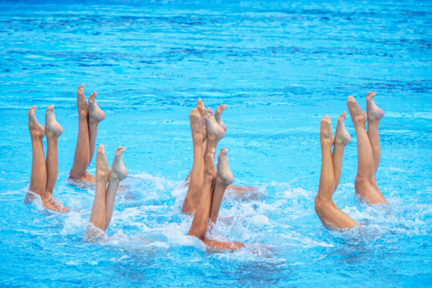 istock Artistic swimming team performing synchronized legs movement in swimming pool 2161517166