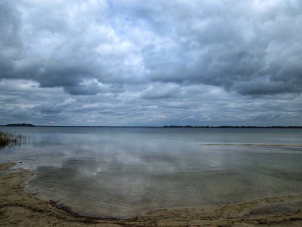 istock Tranquil Autumn Lake under Overcast Sky 2161517327