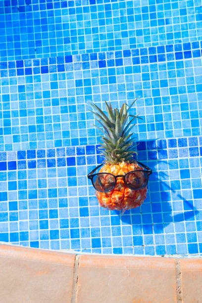 istock pinapple near swimming pool 2161517420