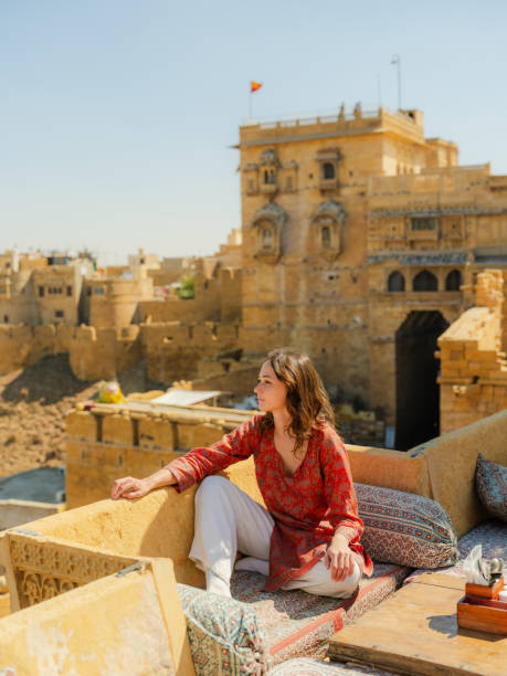 istock Woman looking at Jaisalmer fort from balcony 2161519178