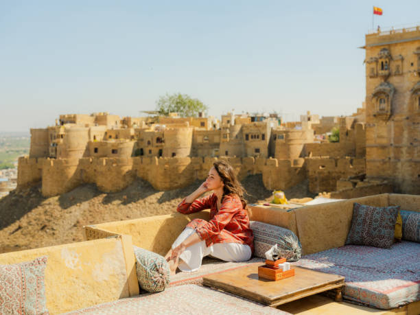 istock Woman looking at Jaisalmer fort from balcony 2161519311