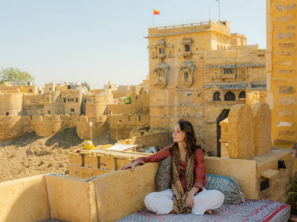 istock Woman looking at Jaisalmer fort from balcony 2161521228