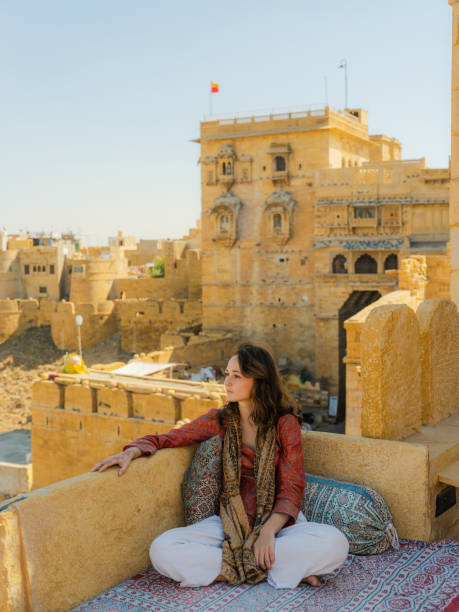 istock Woman looking at Jaisalmer fort from balcony 2161521233