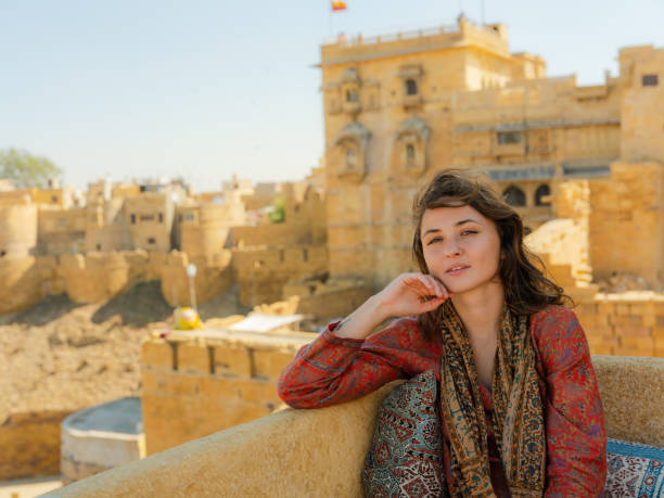istock Woman looking at Jaisalmer fort from balcony 2161521561