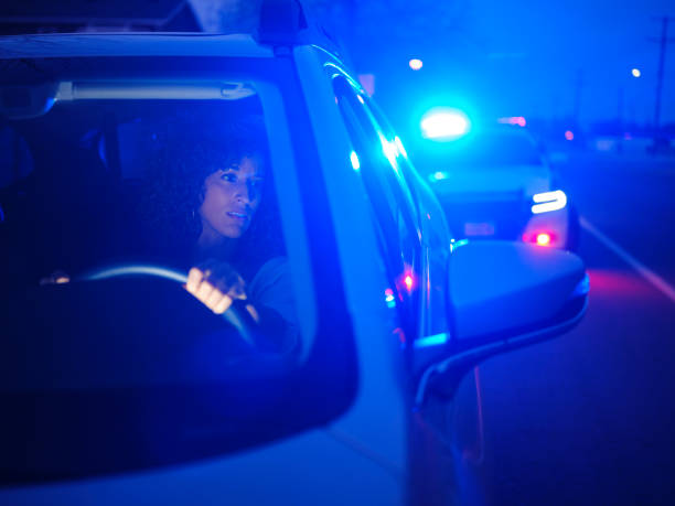 istock Young Woman Driver Pulled Over By Police at Night 2161523684