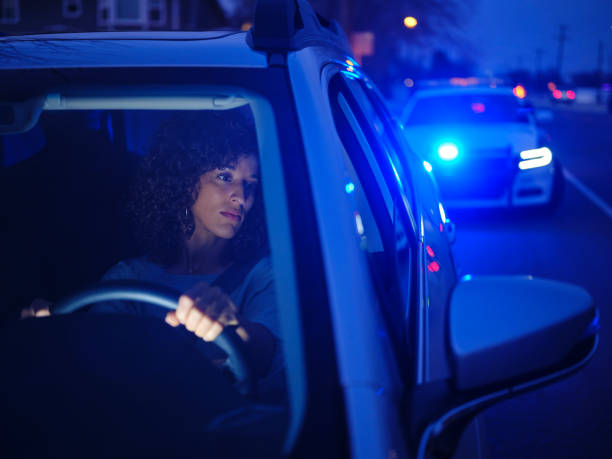 istock Young Woman Driver Pulled Over By Police at Night 2161523699