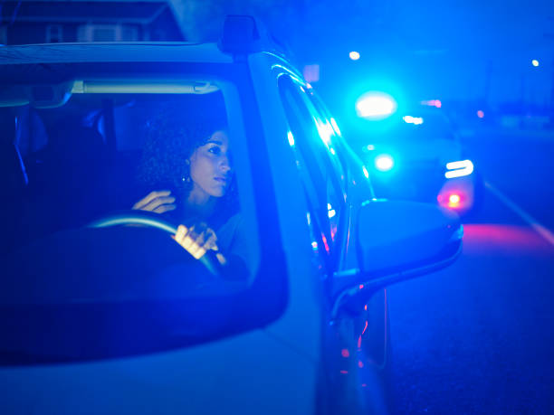 istock Young Woman Driver Pulled Over By Police at Night 2161523773