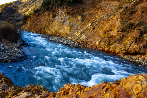 istock The river passes very quickly and takes everything it sees, dark blue water 2161526070