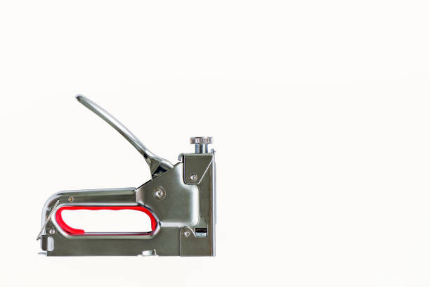 A construction stapler. A tool for repair and construction. A working tool. The construction industry.