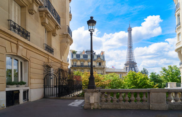 istock eiffel tour and Paris street 2161528138