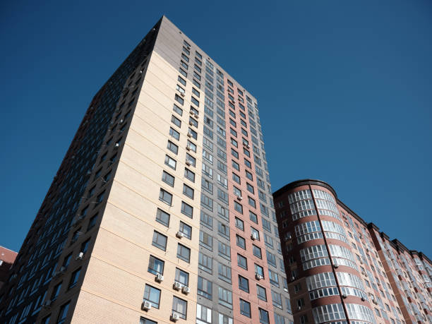 istock Multi-storey residential buildings in a new complex against a clear sky. 2161532951