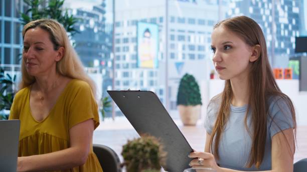 istock Gen Z young adult looking over personalized financial planning guide 2161535725