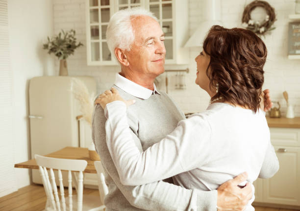 istock Happy active elderly senior couple dancing in kitchen. 2161541231
