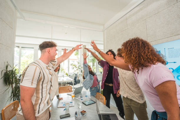 istock Gen Z and Diverse Team's Post-Meeting Huddle 2161546649