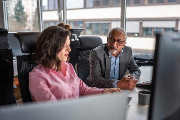 istock Diverse Business Colleagues Collaborating Indoors 2161546719