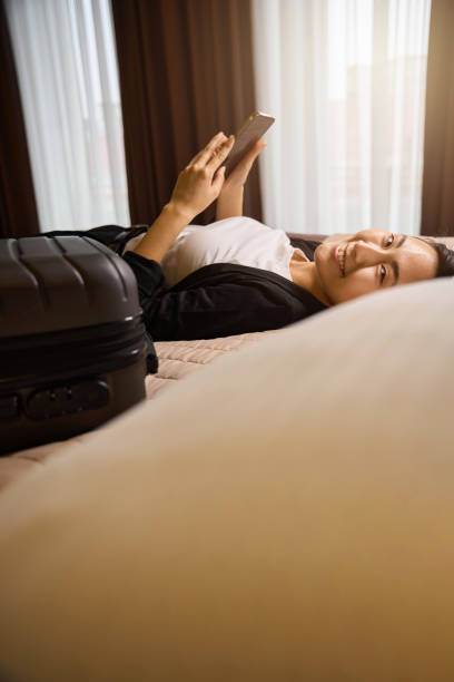 istock Smiling woman resting and looking for places she will go next 2161546830