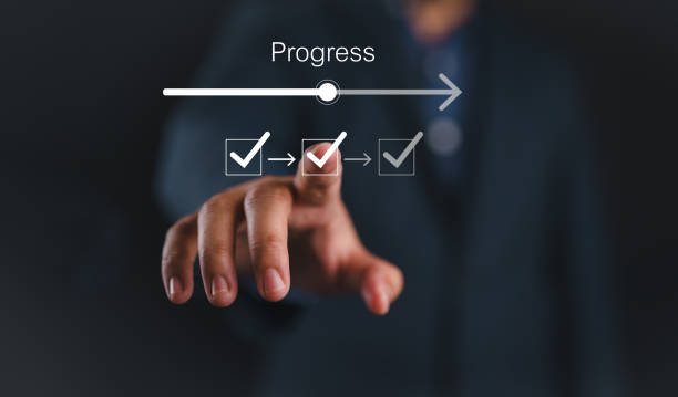 Businessman or manager touching on checklist to tick correct mark with progressive loading status to remind work task progressive for project develop management and tracking concept.