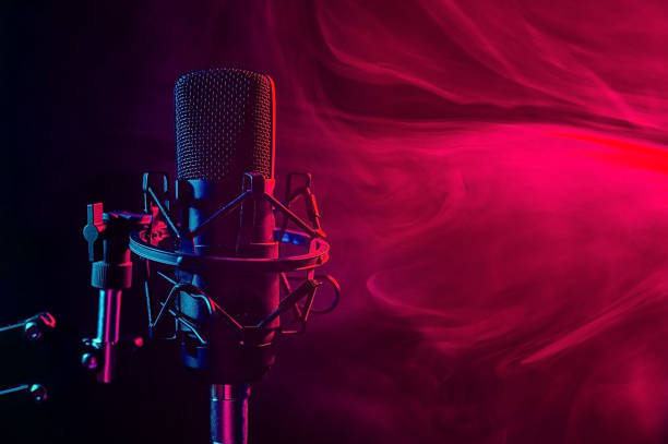 istock Professional microphone in red smoke on a black background. 2161547285