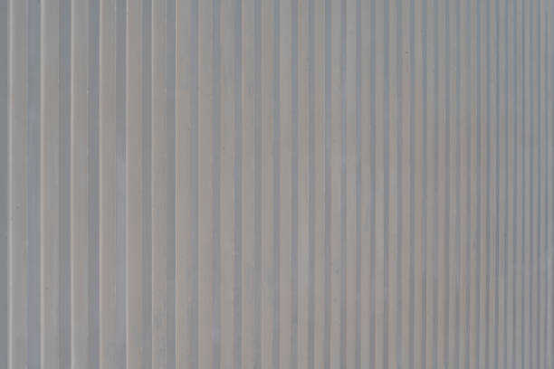 vertical lined texture. surface of the wall with a decorative. textured concrete wall with vertical lines and stripes as a texture.