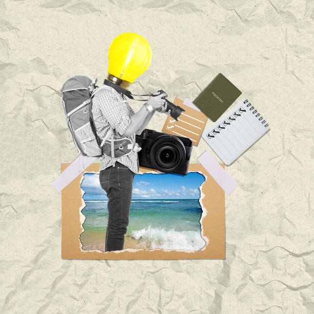 A man with the head of a bright light bulb with a backpack holding a camera with a beach