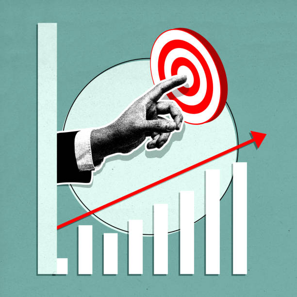 istock Businessman pointing at target with growing chart representing business success 2161554574