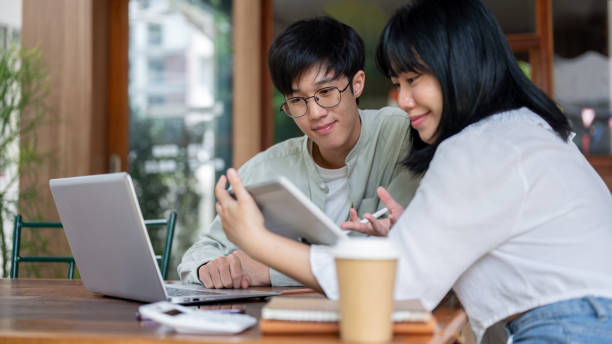 istock A man is listening to his female colleague explaining her ideas for the project, working remotely. 2161557708