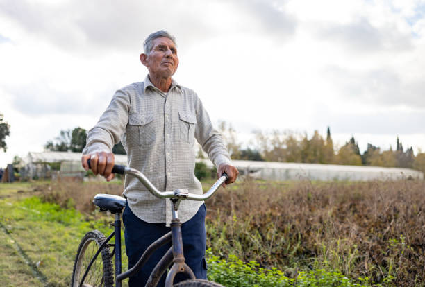 Latin American farmer using a bicycle as mode of transport - simple living concepts