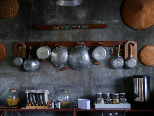istock kitchen utensils mounted on the wall. copper cookware. vintage kitchen interior 2161558743