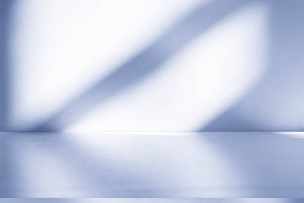istock Studio style background wall decoration presentation uses white and blue tones. with shadows cast from a nearby window, concept creating a decorative backdrop. 2161564008