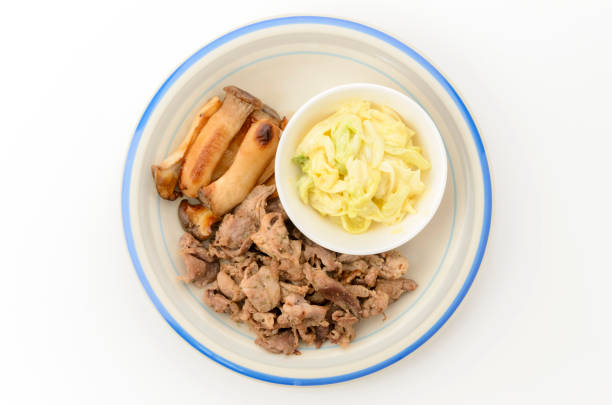 sauteed pork and king oyster mushrooms with dressed mustard cabbage