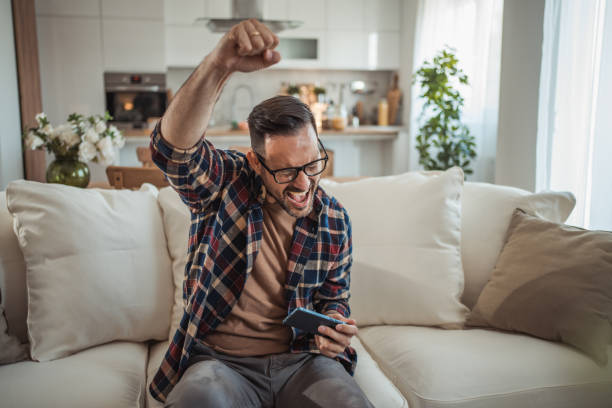 istock I enjoy playing a video game on my mobile phone 2161571017
