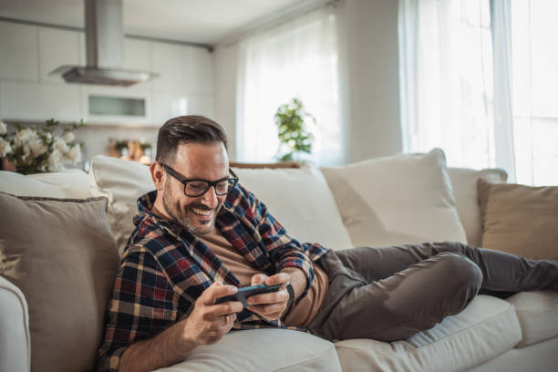 istock I enjoy playing a video game on my mobile phone 2161571054